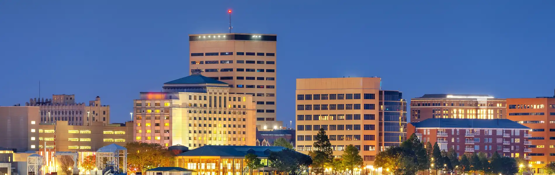 Neon color image of a band playing and people singing along