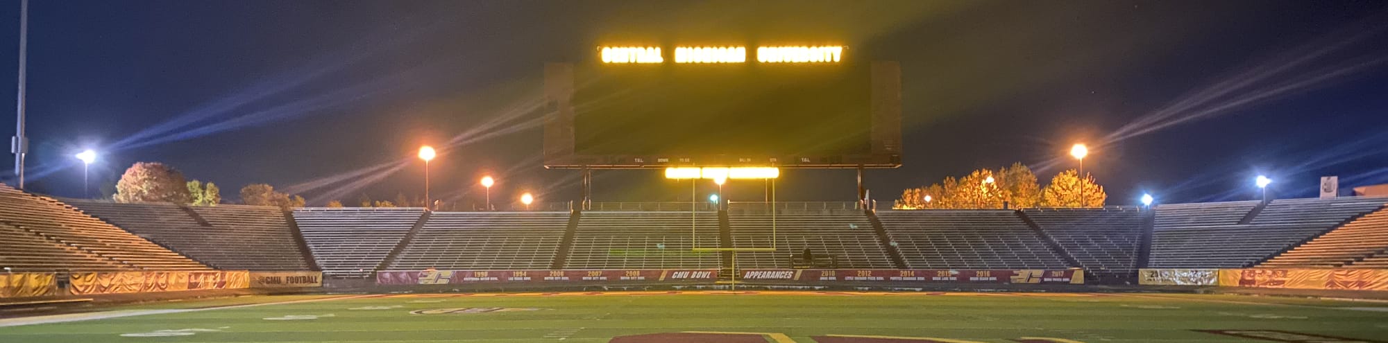 empty football stadium at night under the lights Evansville